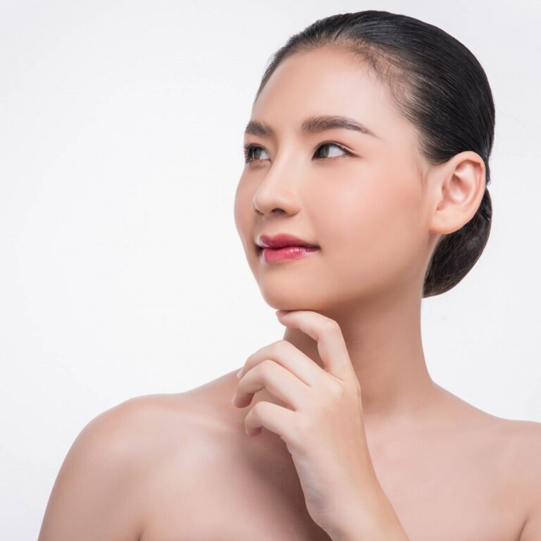 woman-using-finger-touch-chin_1150-24003